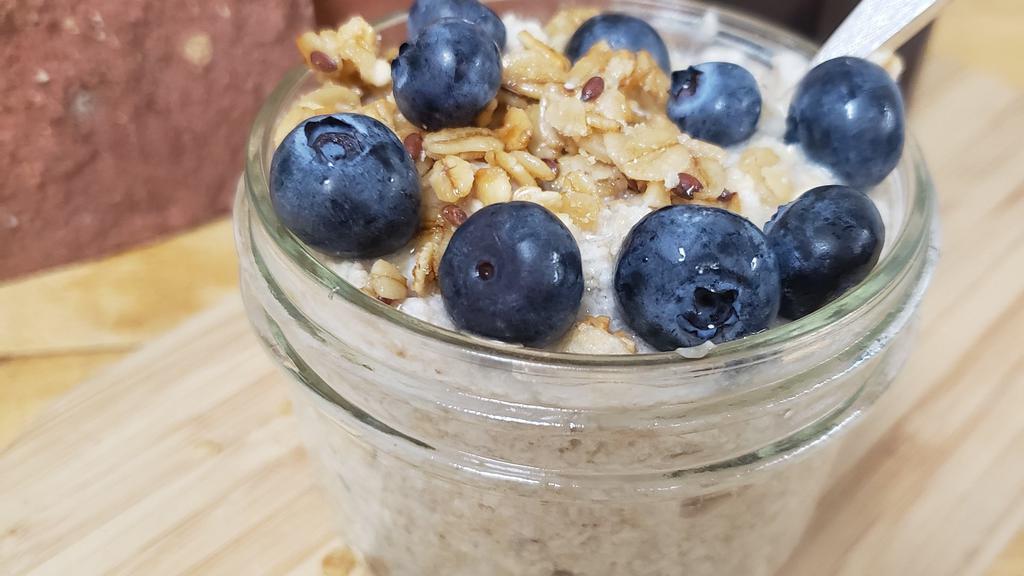 Blueberry Crisp Overnight Oats · Rolled oats soaked in almond milk & mixed with maple syrup, vanilla, blueberries, & almonds.