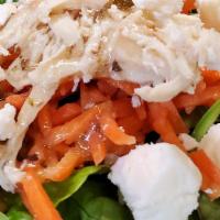 Greek Chicken Salad · Shredded chicken breast in a feta greek dressing layered with shredded carrots, minced garli...
