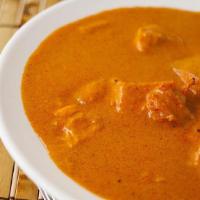 Chicken Curry · Cubes of tender chicken cooked in traditional curry sauce.