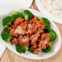 Sesame Chicken · Chunk of chicken deep fried until golden brown sauteed with broccoli, sweet and sour sauce a...