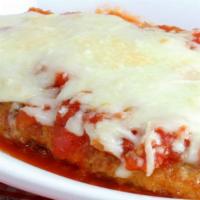 Chicken Parmigiana · Breaded and pan fried chicken breast, covered with parmigiana cheese and baked in oven. Serv...