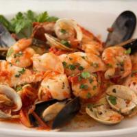 Zuppa Di Mare · Linguine pasta, served with shrimp, mussels, clams, calamari, scallops in spicy tomato sauce