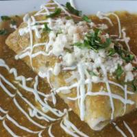 Burrito Ahogado · Spicy. Burrito filled with rice, black beans, cheese and your choice of steak, chicken or ca...