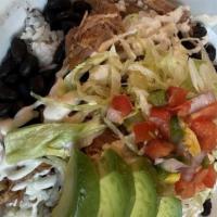 Lola Bowl · Rice, beans, lettuce, mango pico de gallo, choice of steak, chicken, or carnitas topped with...