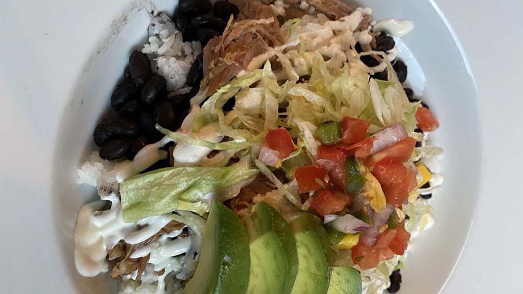 Lola Bowl · Rice, beans, lettuce, mango pico de gallo, choice of steak, chicken, or carnitas topped with Mexican cream, queso fresco and avocado add fish or shrimp for 5.