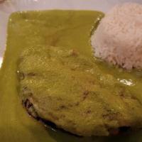 Pollo Relleno · Chicken breast stuffed with queso fresco, finished with a creamy poblano pepper sauce and wh...