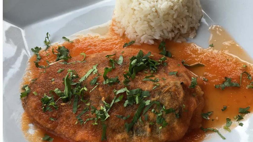 Chile Relleno De Queso · Vegetarian. Battered roasted poblano pepper, stuffed with queso fresco, topped with tomato sauce and served with a side of rice.