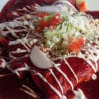 Enchiladas · Vegetarian. Three corn tortillas filled with carrots and potatoes, topped with a chile pasil...
