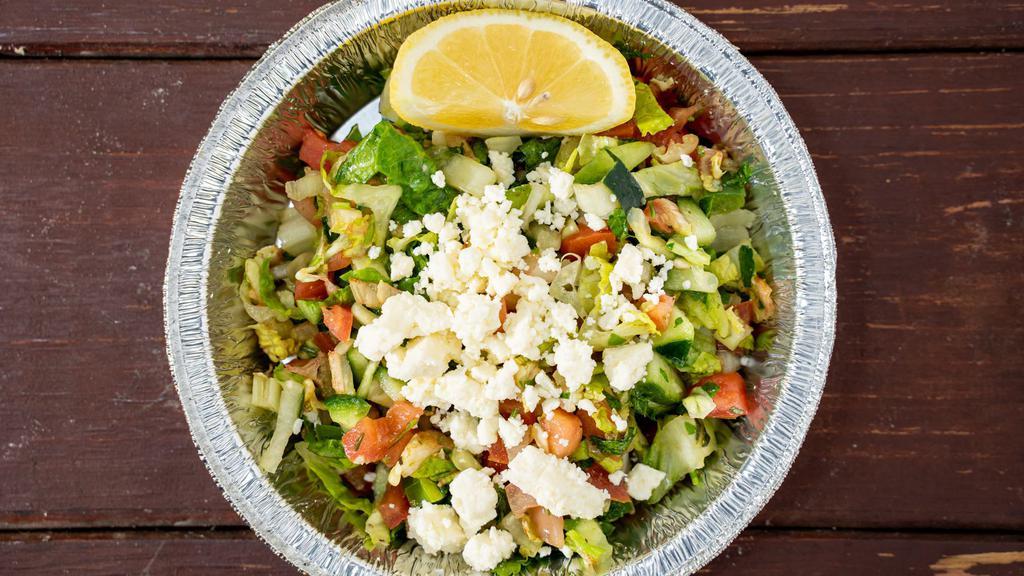 Greek Salad · Fresh dices of tomatoes, cucumbers, mint, oregano. Organic olive oil, hint of fresh lemon juice. Feta cheese and Ranch sauce on the side.