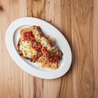Parmigiana · Hand breaded chicken, baked in marinara sauce, topped with mozzarella and served with spaghe...