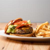 House Burger · Caramelized onions, bacon, cheddar cheese, secret sauce and grilled brioche bun served with ...