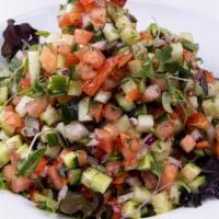 Chopped Israeli Salad · Tomato, cucumber, red bell pepper, red onion, mint and parsley. Vegan.