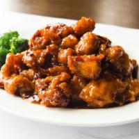 Orange Chicken · Chopped, battered, and fried chicken pieces coated in a sweet orange-flavored chili sauce.