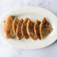 Scallion Pancake · Scallion pancake is a savory, non-leavened flatbread folded with oil and minced scallions (g...