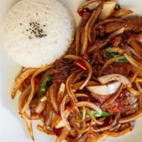 Mongolian Beef · Marinated shredded beef sautéed with scallion and onion in brown sauce.