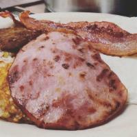 Meatlover'S Breakfast · Three eggs any style with two bacon strips, two sausage patties and smoked ham, plus hash br...