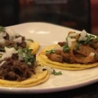 Tacos · Served with cilantro and onions, on flour or corn tortillas. Bistec, Chicken Fajita, Chichar...