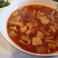 Menudo · Served with onions, cilantro, limes, and your choice of flour or corn tortillas.