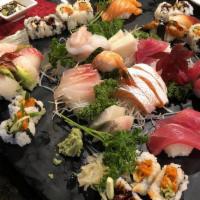 Sushi & Sashimi Dinner · Combination of assorted sushi and sashimi and one California roll.