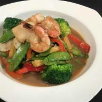 Seafood Combination · Sautéed jumbo scallops and shrimps with red bell peppers, asparagus, baby corn, snow peas, a...