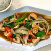 Pad Kra Pao · Sautéed with basil leaves, onions, mushrooms, bell peppers in a hot and spicy chili sauce.