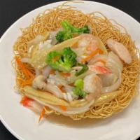 Lard Nar Ta Lay · Combination of shrimp, squid, crab sticks, and vegetables, served on a bed of crispy egg noo...