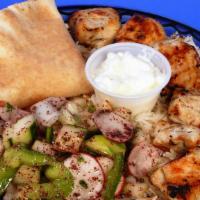 Chicken Kabob · Grilled marinated cubes of chicken breast with lemon juice, garlic and olive oil, served wit...