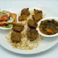Lamb Kabob · Grilled marinated tender leg of lamb with spices, served with yogurt sauce.