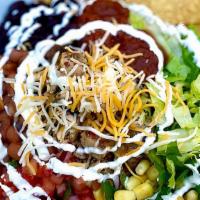 Burrito Bowl · Everything in a burrito without the tortilla. Bed it with rice or greens and top it with you...