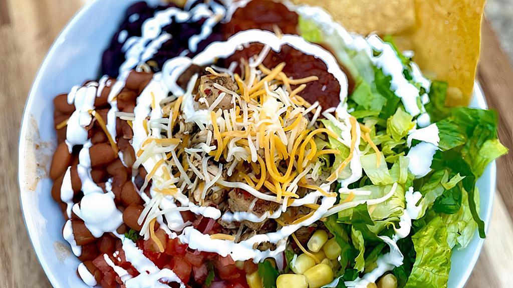 Burrito Bowl · Everything in a burrito without the tortilla. Bed it with rice or greens and top it with your favorites!