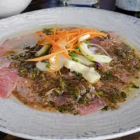 Tuna Carpaccio · Tuna, thin sliced with a delicious sauce made of capers, cilantro, fresh lime juice soy sauc...