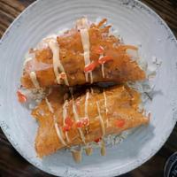Costra Pacifica- Shrimp · Crispy grilled cheese tortilla stuffed with battered shrimp, topped with cabbage, pico de ga...