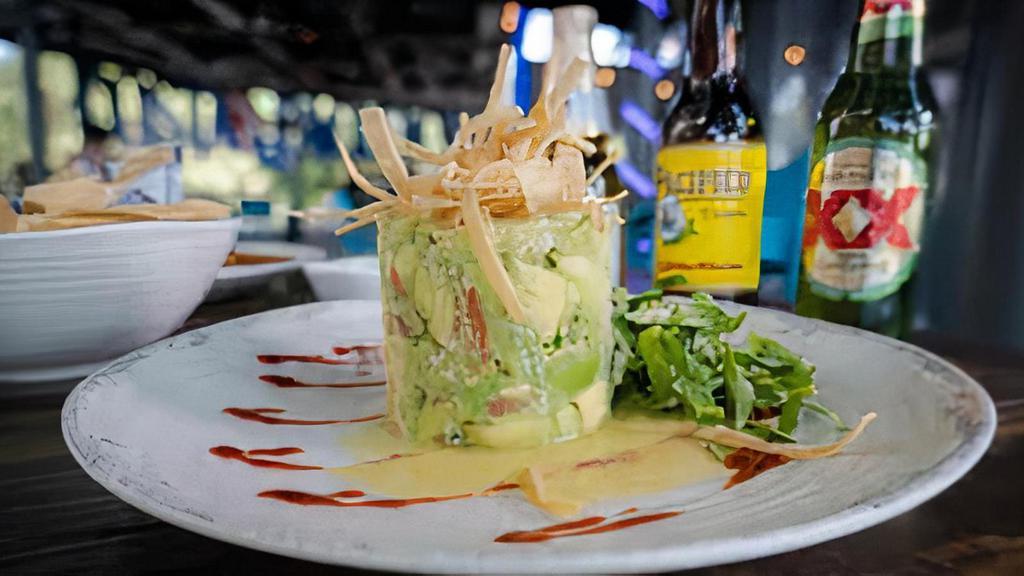 Guacamole Costa · Fresh made to order avocado chunks with pico de gallo topped with our lime dressing and served with tortilla strips.