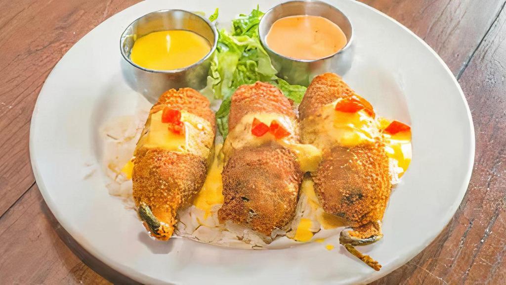 Shrimp Toritos · Three pieces of breaded jalapeño peppers stuffed with shrimp and jack cheese with a sweet mango dressing.