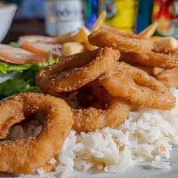 Calamari · Breaded seasoned calamari fried to perfection, on a bed of white rice, served with homemade ...