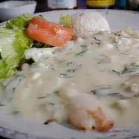 Popeye Fillet · Grilled fish filet, with a creamy spinach, and mushroom sauce, topped with grilled cheese an...