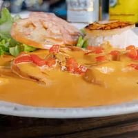 Shrimp Tiki Tiki · Butter grilled shrimp topped with a white wine creamy chipotle sauce and served with homemad...