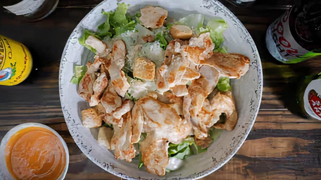 Caesar Salad · Fresh romaine lettuce tossed with caesar dressing, croutons and Parmesan cheese.