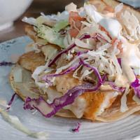 Grilled Fish Taco Plate · Grilled fish served in a homemade corn tortilla with pico de gallo and shredded cabbage topp...