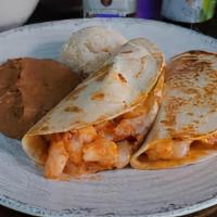 Shrimp Taco Plate · Shrimp cooked with our homemade tomato sauce and spices, served with a thin layer of refried...