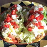 Huarache · Oblong fried corn meal with refried black beans inside. Steak, green salsa, queso fresco, an...