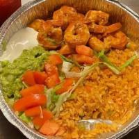 Camarones A La Diabla · Spicy shrimp, guacamole, and rice.