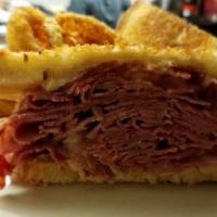Mylo'S Classic Reuben · In-house prepared corned beef with Swiss cheese, sauerkraut & thousand island dressing on gr...