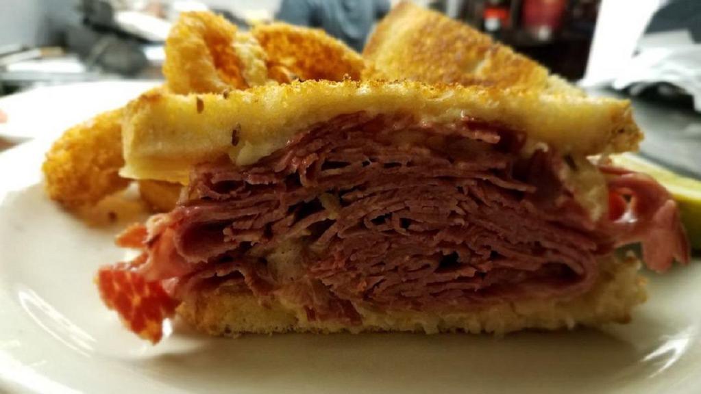 Mylo'S Classic Reuben · In-house prepared corned beef with Swiss cheese, sauerkraut & thousand island dressing on grilled rye bread.