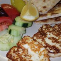 Grilled Halloumi · Grilled Cyprus Cheese served with sliced tomatoes, cucumber, olives & pita bread