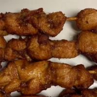 Satay Chicken Skewers (4) · Fried marinated chicken on the skewers.