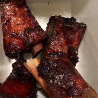 Chinese Oven Ribs · Oven cooked pork ribs marinated in our special BBQ sauce.