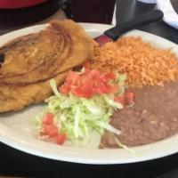Chile Relleno Plate · Stuffed roasted poblano pepper battered with egg and fried. Served with rice, refried beans,...