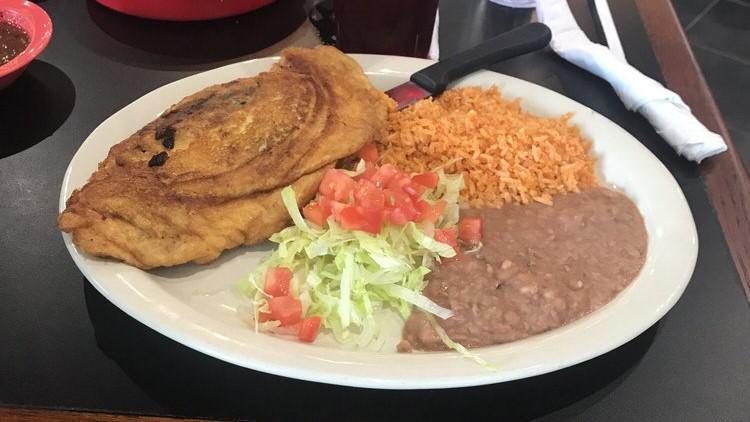 Chile Relleno Plate · Stuffed roasted poblano pepper battered with egg and fried. Served with rice, refried beans, and three handmade tortillas.