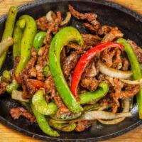 Beef Fajitas - Fajitas De Res · Marinated skirt steak, onion, red and green bell pepper. Served with rice and beans.
Guacamo...